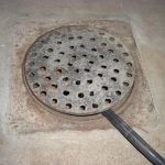 How to Replace a Floor Drain Cover That Is Damaged
