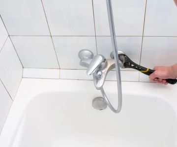How to Fix Water Leaks Around a Bathtub Enclosure